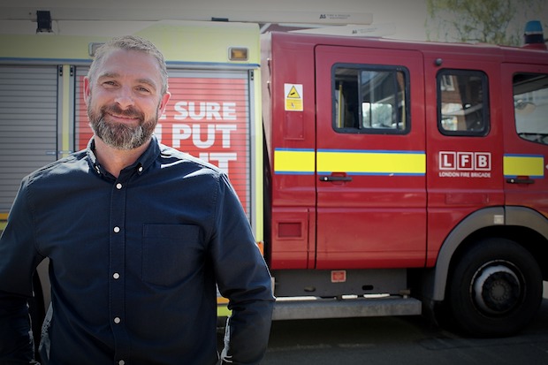 Keith Potter - Youth Custody prison officer - standing in front of a fire engine