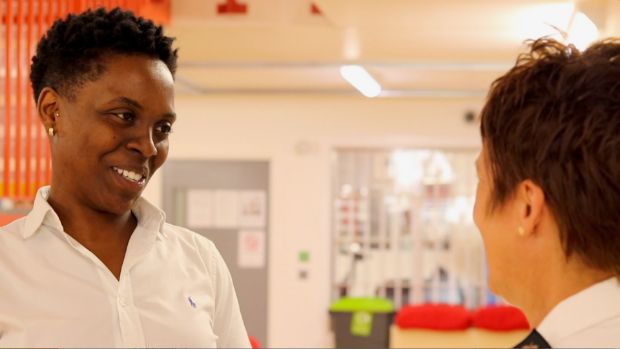 Fiona Merrifield speaking with another member of staff