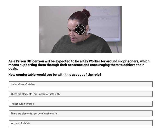 A screen shot of the self-selection tool. The image shows a woman looking down. The question underneath reads: As a prison officer you will be expected to be a key worker for around six prisoners, which means supporting them through their sentence and encouraging them to achieve their goals. How comfortable would you be with this aspect of the role? The multiple choice answers are: Not at all comfortable, There are elements I am uncomfortable with, I'm not sure how I feel, There are elements I am comfortable with, Very comfortable.