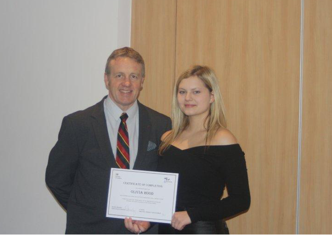 A photograph of Officer Hood and her apprenticeship tutor at the prison officer apprenticeship graduation.